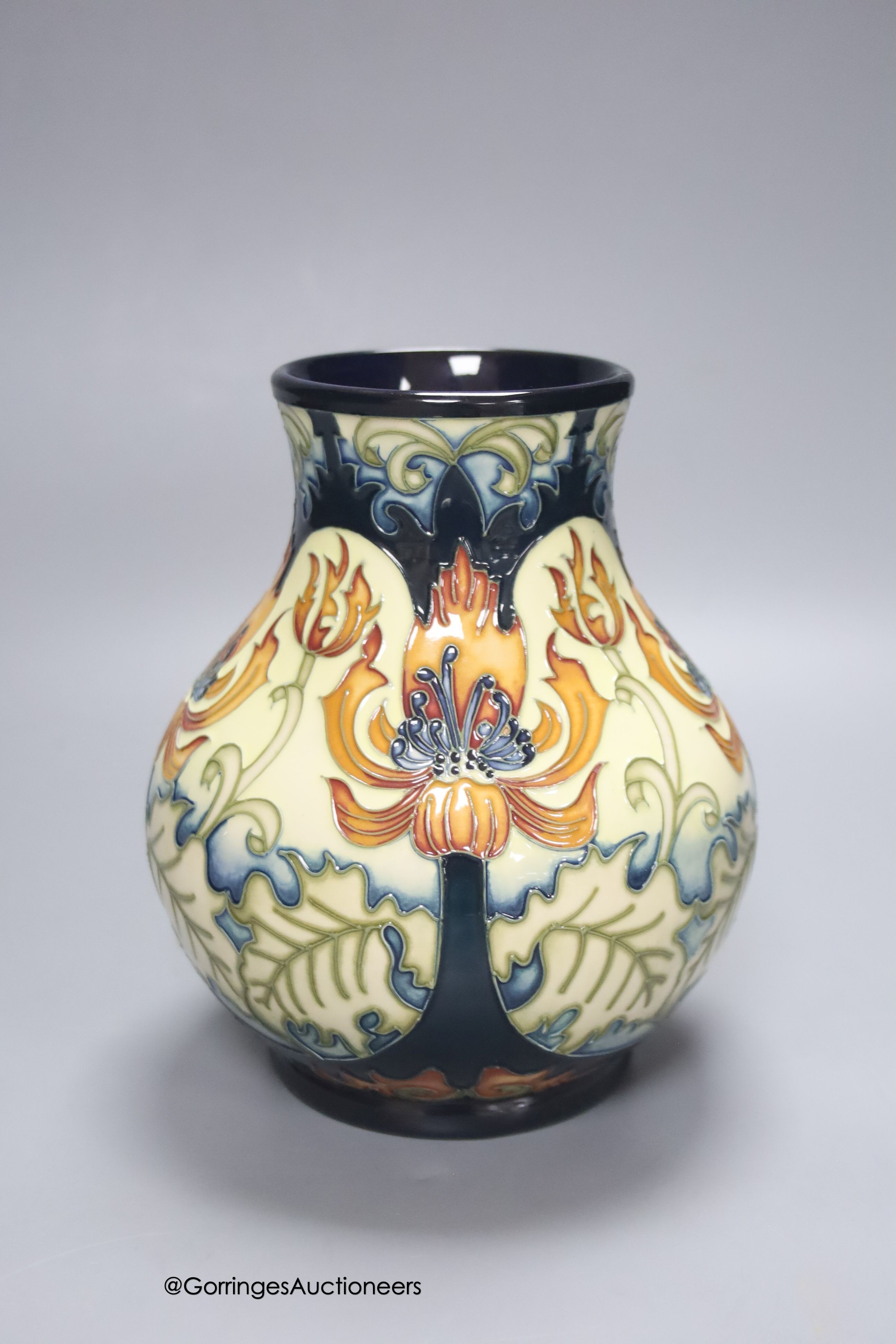 A boxed limited edition Moorcroft pottery vase in the Festive Flame pattern, designed by Kerry Goodwin, painted by Paul Hilditch, signed and numbered 7/100, height 16cm